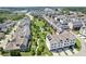 An aerial view showcasing the neighborhood with green spaces, sidewalks, and varied home styles at 6930 Whitman Walk, Alpharetta, GA 30005