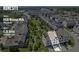Aerial view of neighborhood and property with approximate property lines, address, and community green spaces at 6930 Whitman Walk, Alpharetta, GA 30005