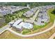 Aerial view showcasing a community pool, clubhouse, and meticulously planned neighborhood layout at 6930 Whitman Walk, Alpharetta, GA 30005