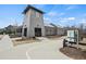 Community building with architectural detail and signage near walking trail at 6930 Whitman Walk, Alpharetta, GA 30005