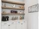 This Butler's Pantry offers ample counter and shelf space perfect for entertaining at 6930 Whitman Walk, Alpharetta, GA 30005