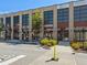 Exterior shot of a commercial building featuring multiple storefronts and accessible parking at 6930 Whitman Walk, Alpharetta, GA 30005