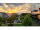 Scenic community view at sunset featuring well-kept lawns, mature trees, and attractive residential buildings at 6930 Whitman Walk, Alpharetta, GA 30005