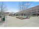 Inviting community space with lounge seating, green spaces and a mix of retail and office buildings at 6930 Whitman Walk, Alpharetta, GA 30005