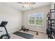 Home gym with treadmill, rowing machine, and a large window, perfect for workouts at 6930 Whitman Walk, Alpharetta, GA 30005