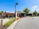Exterior of a modern restaurant with outdoor seating, showcasing contemporary architecture and landscaping at 6930 Whitman Walk, Alpharetta, GA 30005