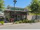Exterior view of a commercial building with contemporary design, showcasing a pet grooming business and storefront at 6930 Whitman Walk, Alpharetta, GA 30005