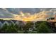 Stunning community landscape with lush greenery and picturesque sunset backdrop at 6930 Whitman Walk, Alpharetta, GA 30005