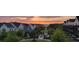 Scenic view of homes surrounding a park and green space at sunset at 6930 Whitman Walk, Alpharetta, GA 30005