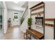 Light and bright foyer with hardwood floors and coat rack, setting a welcoming tone for guests at 6930 Whitman Walk, Alpharetta, GA 30005