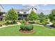 Beautifully landscaped front yard with walking paths and green spaces at this charming residence at 6930 Whitman Walk, Alpharetta, GA 30005