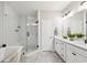 Stylish main bathroom with a glass-enclosed shower, soaking tub, and double vanity at 6930 Whitman Walk, Alpharetta, GA 30005