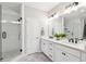 Main bathroom with a glass-enclosed shower, double vanity, and modern fixtures at 6930 Whitman Walk, Alpharetta, GA 30005