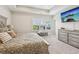 Main bedroom with a tray ceiling, large window, and television mounted on the wall at 6930 Whitman Walk, Alpharetta, GA 30005