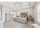 Spacious and inviting main bedroom showcasing a large bed and ample natural light at 6930 Whitman Walk, Alpharetta, GA 30005