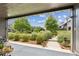 A relaxing view of the outdoor living area, featuring a walkway and community greenspace at 6930 Whitman Walk, Alpharetta, GA 30005