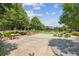 Outdoor patio area with tables and chairs, perfect for community gatherings at 6930 Whitman Walk, Alpharetta, GA 30005
