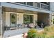 Cozy front porch with comfortable seating, offering a welcoming entrance to the home at 6930 Whitman Walk, Alpharetta, GA 30005