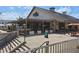 Restaurant with outdoor seating, stairs, and lush landscaping at 6930 Whitman Walk, Alpharetta, GA 30005