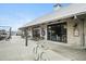 Inviting restaurant exterior with large windows, outdoor seating, and unique architectural details at 6930 Whitman Walk, Alpharetta, GA 30005