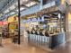 Vibrant restaurant interior featuring a bar area, tables, and visible menu boards, creating a lively dining atmosphere at 6930 Whitman Walk, Alpharetta, GA 30005