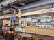 Bright restaurant interior with counter service and ample seating, offering a modern and inviting dining experience at 6930 Whitman Walk, Alpharetta, GA 30005