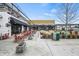 Vibrant restaurant patio with colorful seating, lush greenery, and inviting outdoor ambiance at 6930 Whitman Walk, Alpharetta, GA 30005