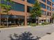 Commercial building street view with retail spaces and modern architecture, showcasing storefronts and landscaping at 6930 Whitman Walk, Alpharetta, GA 30005