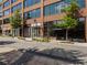 Street view of commercial building with large windows and modern design, highlighting retail spaces at 6930 Whitman Walk, Alpharetta, GA 30005
