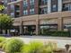 Street view of retail spaces in a commercial building, showcasing modern architecture and XGolf signage at 6930 Whitman Walk, Alpharetta, GA 30005