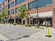Street view of retail shops in a modern, mixed-use development, showcasing storefronts and pedestrian-friendly design at 6930 Whitman Walk, Alpharetta, GA 30005
