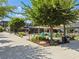 Picturesque town square featuring landscaped seating areas, green spaces, and shade, ideal for a relaxing day out at 6930 Whitman Walk, Alpharetta, GA 30005