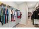 Spacious walk-in closet with ample hanging space and shelving for organized storage at 6930 Whitman Walk, Alpharetta, GA 30005