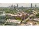 Aerial view of a city skyline with buildings and lush trees at 825 Highland Ne Ln # 1116, Atlanta, GA 30306