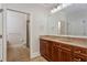 Bathroom with double sinks, vanity, and a separate shower and toilet area at 825 Highland Ne Ln # 1116, Atlanta, GA 30306