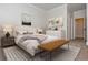 Comfortable bedroom with neutral color palette, stylish furnishings, and ample natural light at 825 Highland Ne Ln # 1116, Atlanta, GA 30306