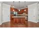 Well-lit kitchen features wood cabinets, granite counters, stainless steel appliances, and a center island at 825 Highland Ne Ln # 1116, Atlanta, GA 30306