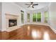 Living room with a fireplace and a wall of windows bringing in natural light at 825 Highland Ne Ln # 1116, Atlanta, GA 30306