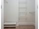 Walk-in closet featuring shelving for storage and a bench for sitting at 825 Highland Ne Ln # 1116, Atlanta, GA 30306