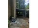 Backyard view showcasing a partially covered patio area and an adjacent grassy space at 1383 Natchez Sw Trce, Marietta, GA 30008