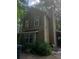 Two-story house featuring vertical siding, complemented by a dark roof and dark shutters at 1383 Natchez Sw Trce, Marietta, GA 30008