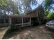 Charming two-story home with wood siding and a white picket fence at 1383 Natchez Sw Trce, Marietta, GA 30008