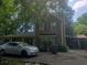 Two-story home with wood siding and a car parked out front at 1383 Natchez Sw Trce, Marietta, GA 30008