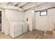 Unfinished basement with laundry hookups, a fire extinguisher and door to the back at 217 Rockyford Ne Rd, Atlanta, GA 30317