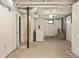 Unfinished basement with laundry, stairs to back, and painted ceiling and walls at 217 Rockyford Ne Rd, Atlanta, GA 30317