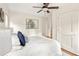 Bright bedroom features a ceiling fan, ensuite bathroom access and a double door closet at 217 Rockyford Ne Rd, Atlanta, GA 30317