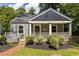 Charming home with a welcoming front porch and manicured landscaping at 217 Rockyford Ne Rd, Atlanta, GA 30317