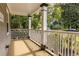 Inviting front porch with white railings, offering a relaxing outdoor space at 217 Rockyford Ne Rd, Atlanta, GA 30317