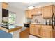 Well-lit kitchen with wood cabinets, granite countertops, and modern appliances at 217 Rockyford Ne Rd, Atlanta, GA 30317