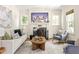 Bright living room featuring a fireplace, comfortable seating, and natural light at 217 Rockyford Ne Rd, Atlanta, GA 30317